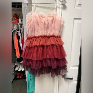 Toole poofy mini dress in different shades of red and pink. Size small.